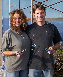 Mary Carole Larson MBPAF Mural artist while painting mural